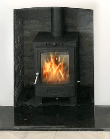 Log burner  in a slate lined  chamber